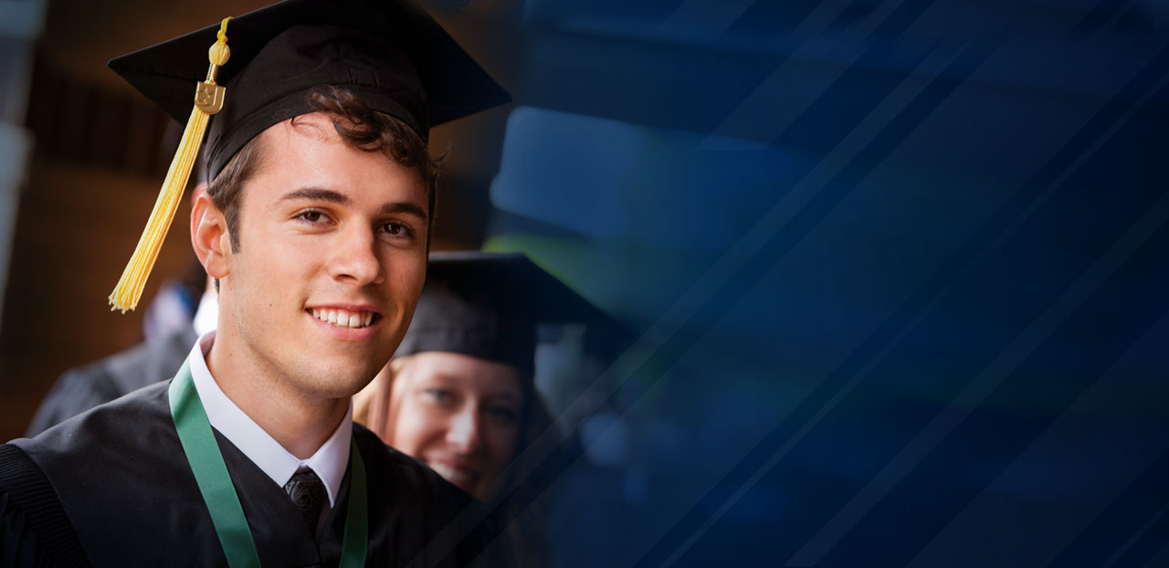 Photo of a smiling student at Commencement
