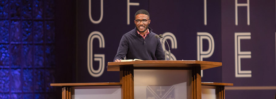 Student speaking in chapel