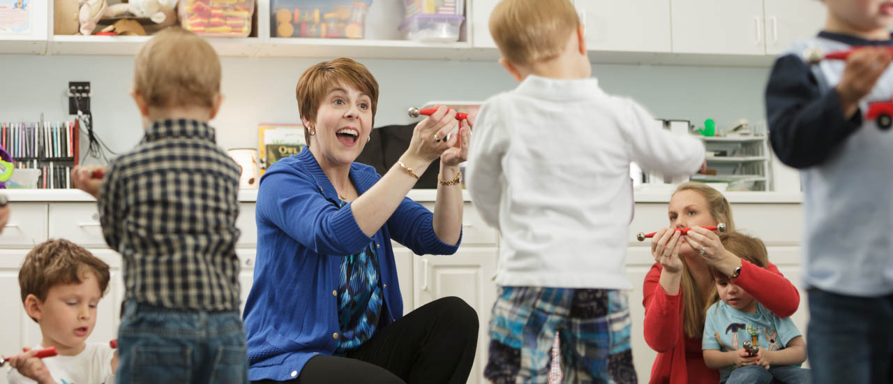 Student teacher with children