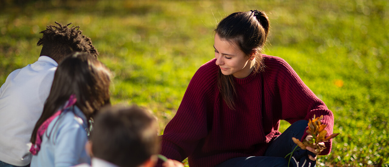 Student teacher with children