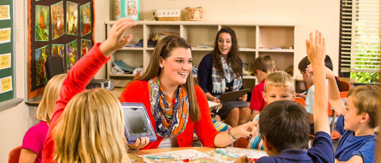 Student teacher with children