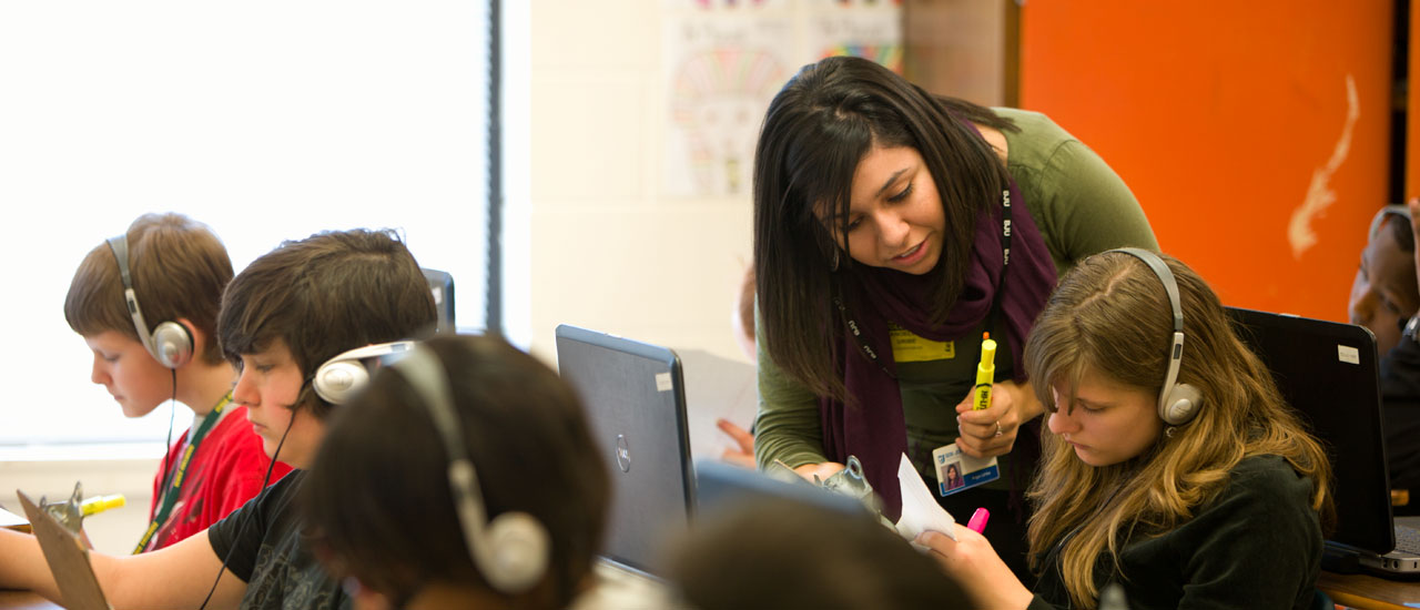 Student teacher with children