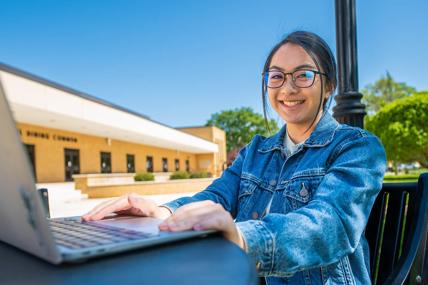 Student candid on campus, spring outside, Bob Jones University, Greenville, SC, April 4, 2023 (Derek Eckenroth)