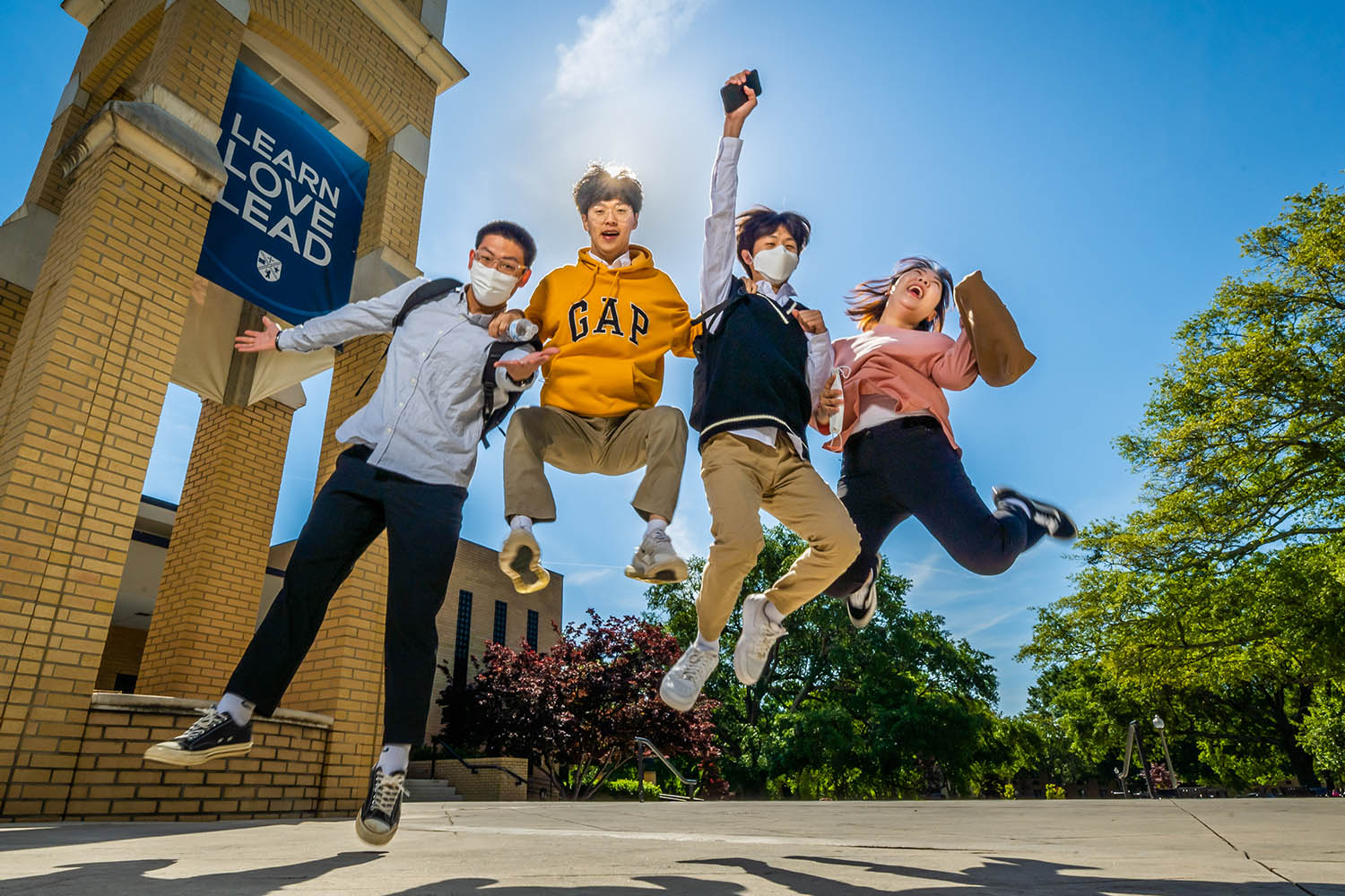 Happy students in the final week of school celebrate for the camera, April 27, 2021. (Derek Eckenroth)