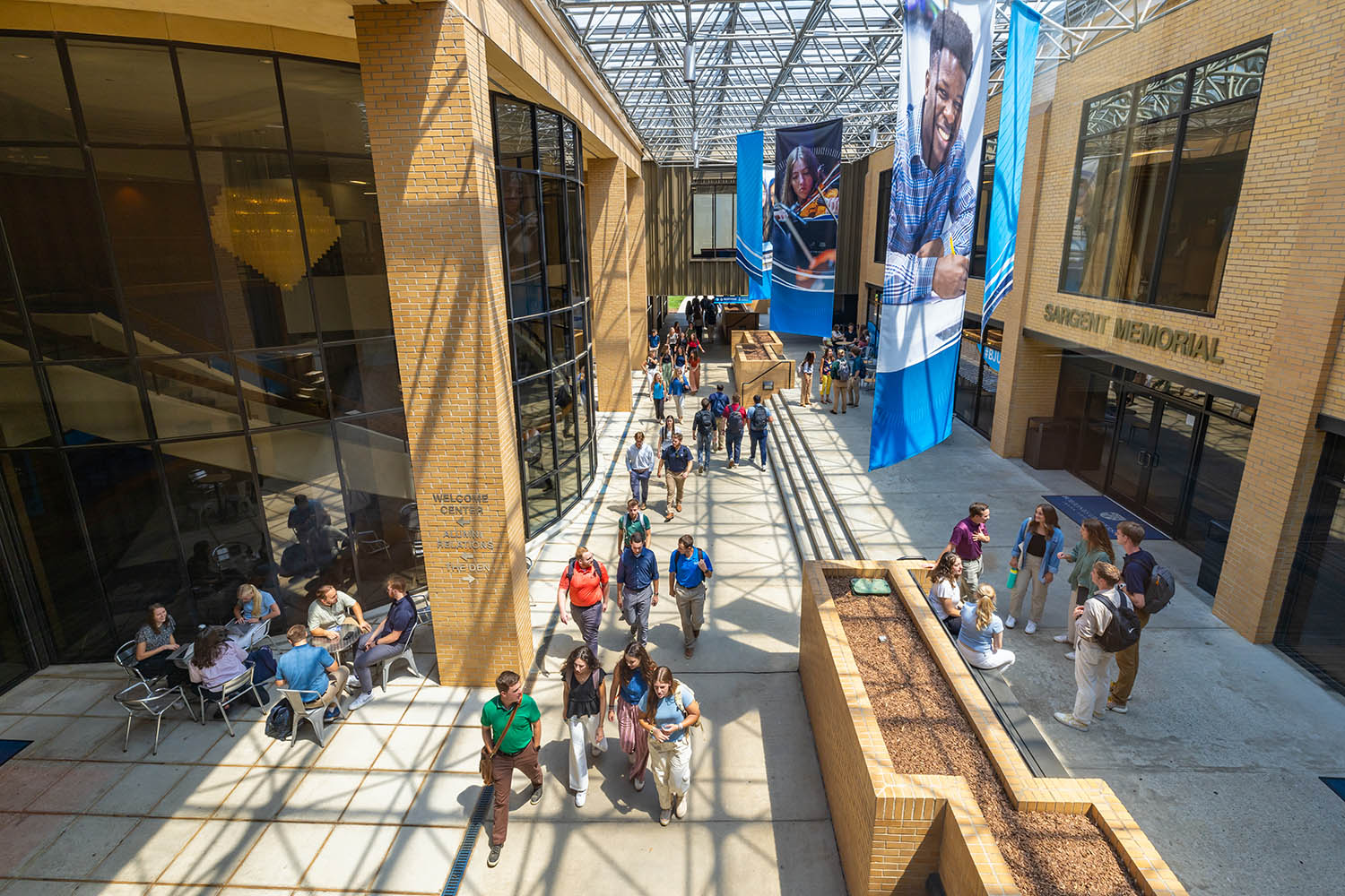 Students walk across campus at Bob Jones University, Greenville S.C., with smiles on their faces, Aug. 20, 2025. (Photo by Derek Eckenroth)