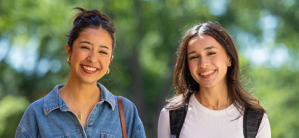 Students glance at the camera while walking across campus at Bob Jones University in Greenville, S.C., May 6, 2025. Photo by Derek Eckenroth