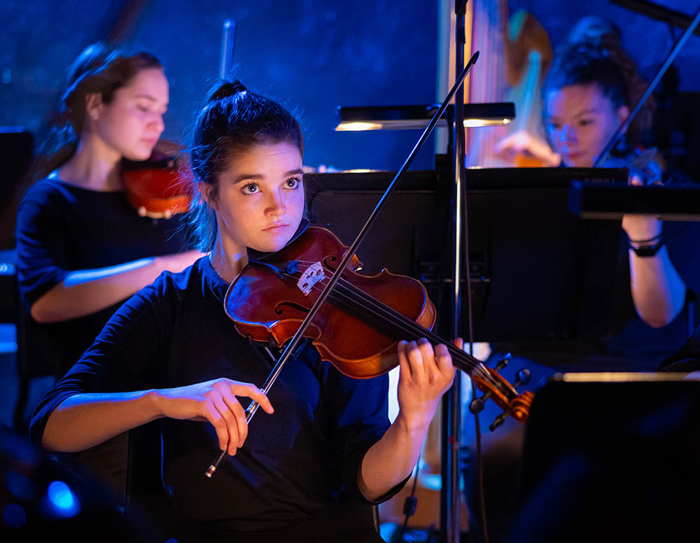 BJU student violinist performing for Living Gallery